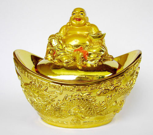 Glücks-Buddha auf Goldbarren